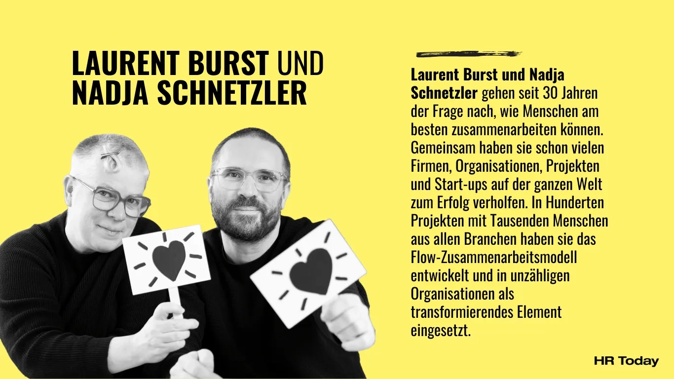 Zu den Personen: Laurent Burst und Nadja Schnetzler gehen seit 30 Jahren der Frage nach, wie Menschen am besten zusammenarbeiten können. Gemeinsam haben sie schon vielen Firmen, Organisationen, Projekten und Start-ups auf der ganzen Welt zum Erfolg verholfen. In Hunderten Projekten mit Tausenden Menschen aus allen Branchen haben sie das Flow-Zusammen­arbeitsmodell entwickelt und in unzähligen Organisationen als transformierendes Element eingesetzt. Das Bild zeigt Nadja Schnetzler und Laurent Burst, zwei Personen mit kurzen Haaren, beide tragen Brille und schwarze Pullis.. Beide halten ein Schildchen mit gezeichneten Herzen hoch.